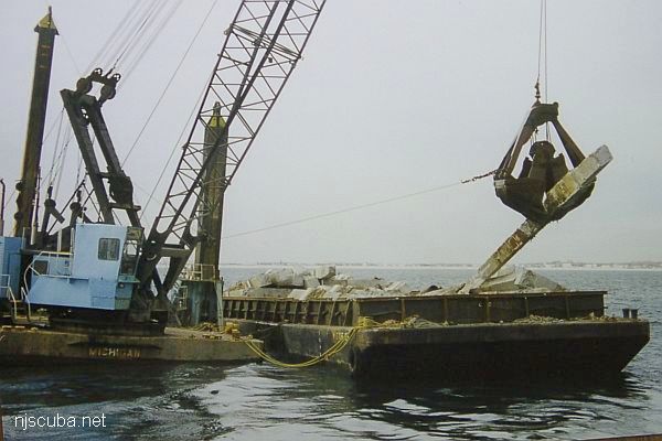 Concrete rubble is dropped onto the Sandy Hook Reef