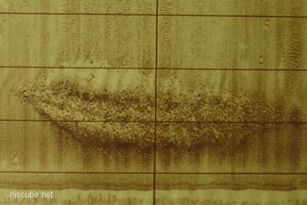 Side-scan sonar image of a single drop of dredge rock from a split hopper barge