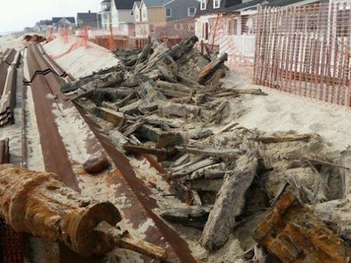 Timber from a 19th century shipwreck uncovered on Brick beach
